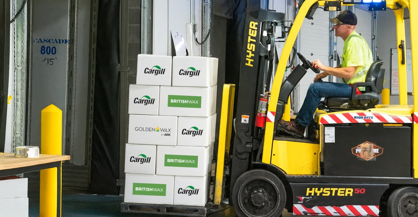 Branded boxes of wax on a forklift